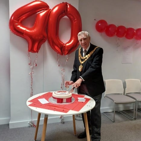 Mayor cutting cake.JPG