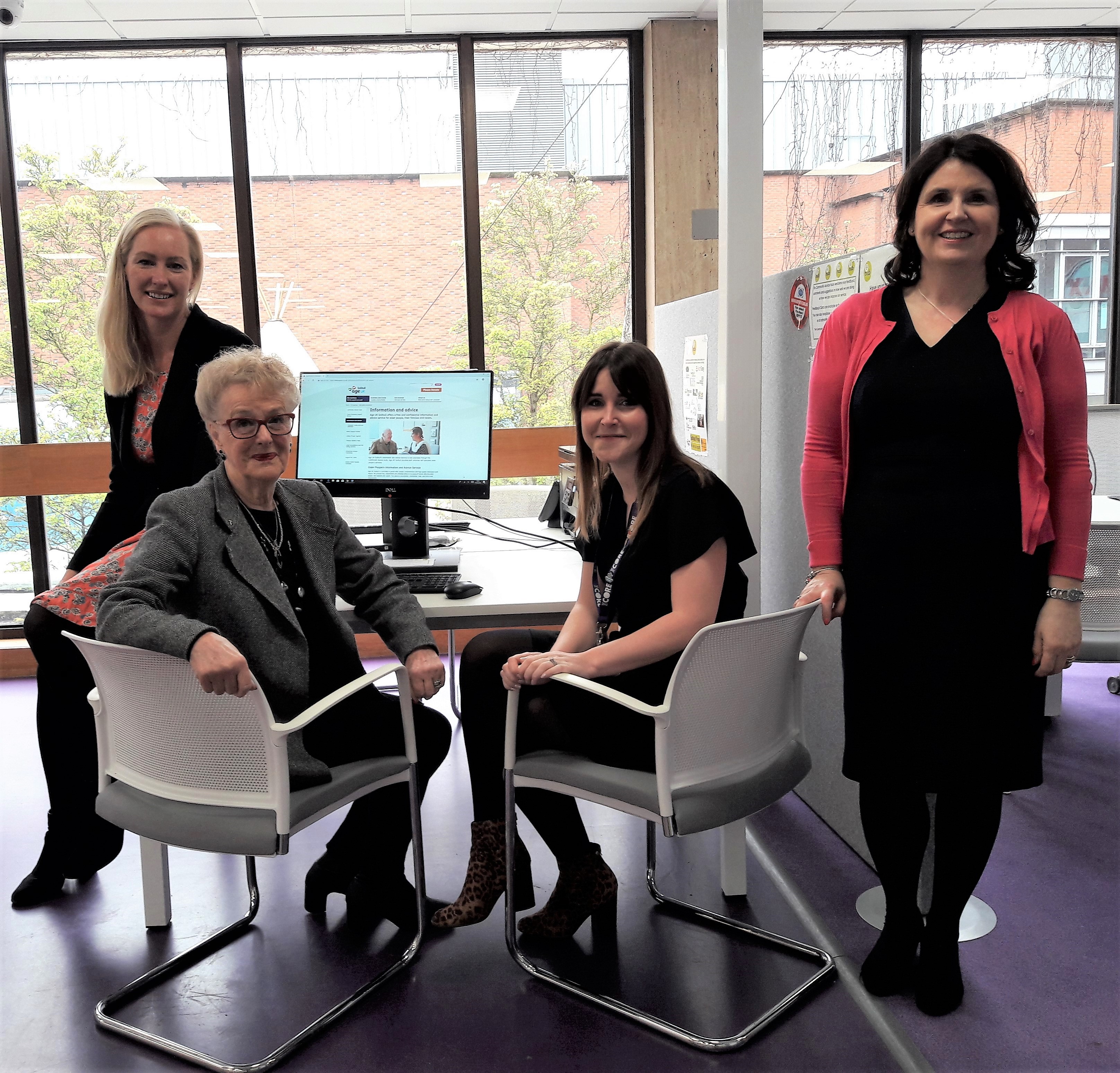 L-R Elaine Shannon (Health and Wellbeing Manager , Xoserve), Margaret (Age UK Solihull client - name has been changed and model used for confidentiality), Kate Turrall (Head of Information and IT, Age UK Solihull), Samantha Scagell (Wellbeing and Engagement Coordinator, Xoserve) with one of the self-help computers.
