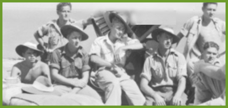 Men sat on sandbags during the war