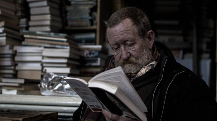 Old man reading a book