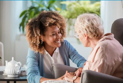 Support worker helping an older woman at home