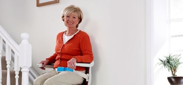 Woman using stairlift