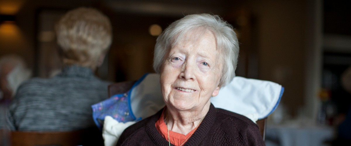 An older woman, smiling