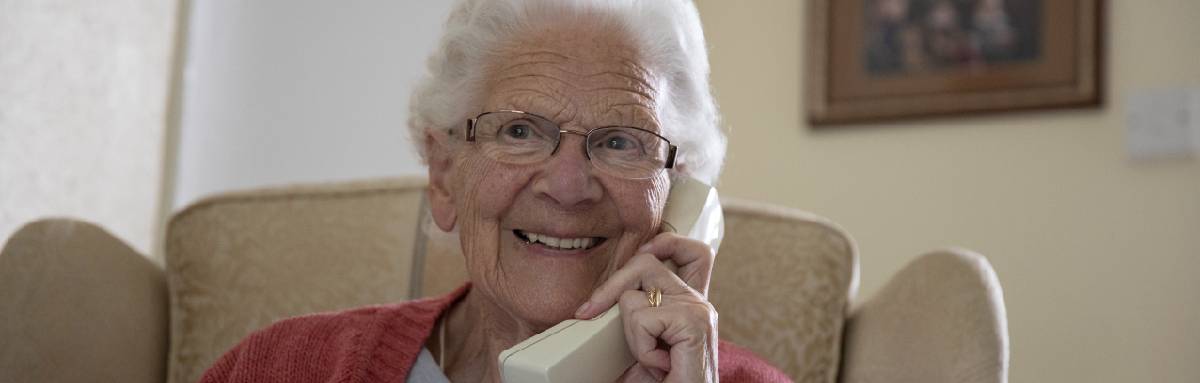 Connie on phone 1200x383.jpg