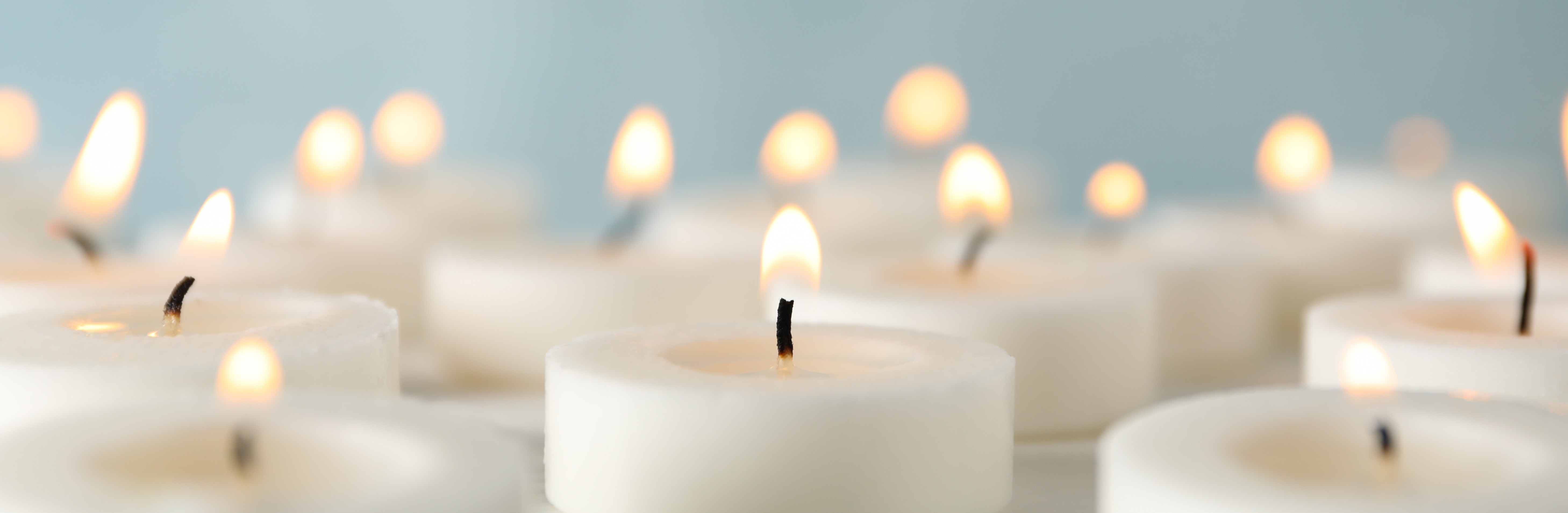 White candles flickering