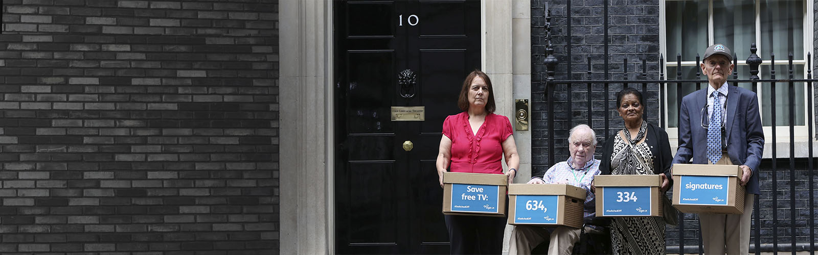 Age UK campaigners hand in a petition to 10 Downing Street