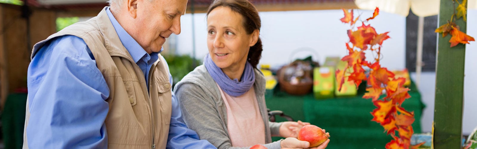 People shopping at vegetable stall