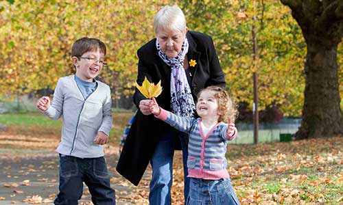 Woman with her grandchildren in the park