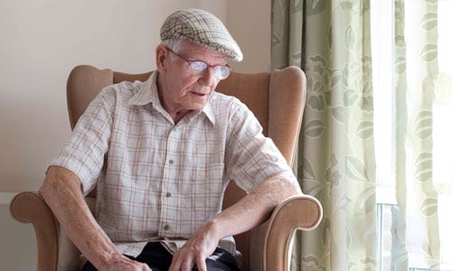 A man in his armchair at home