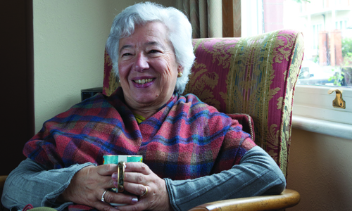 An older woman sat in a chair