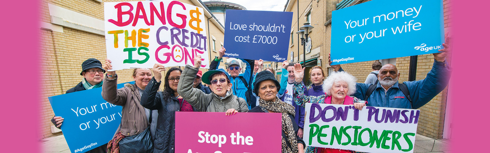 Campaigners against the Age Gap tax holding placards that read 'Your money or your wife', 'Love shouldn't cost £7000', 'Don't punish pensioners', and 'Stop the Age Gap Tax'.