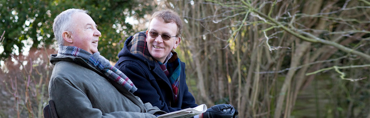Couple sitting on a bench in a park