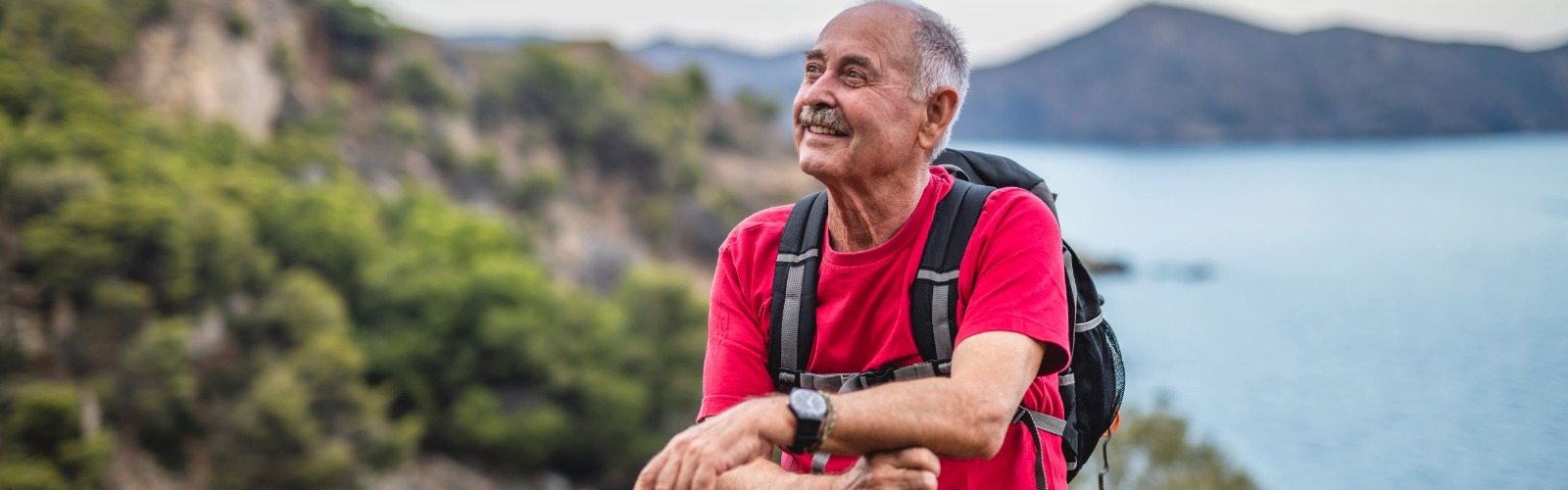 man taking a break on his hike