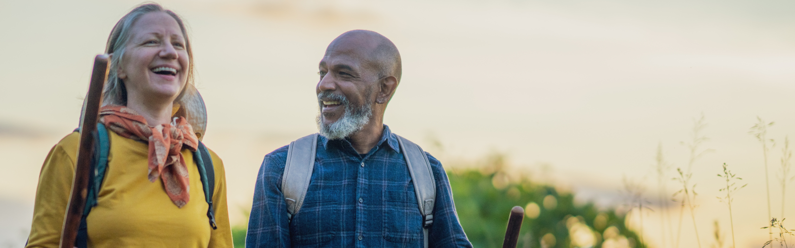 A middle-aged couple out on a hike