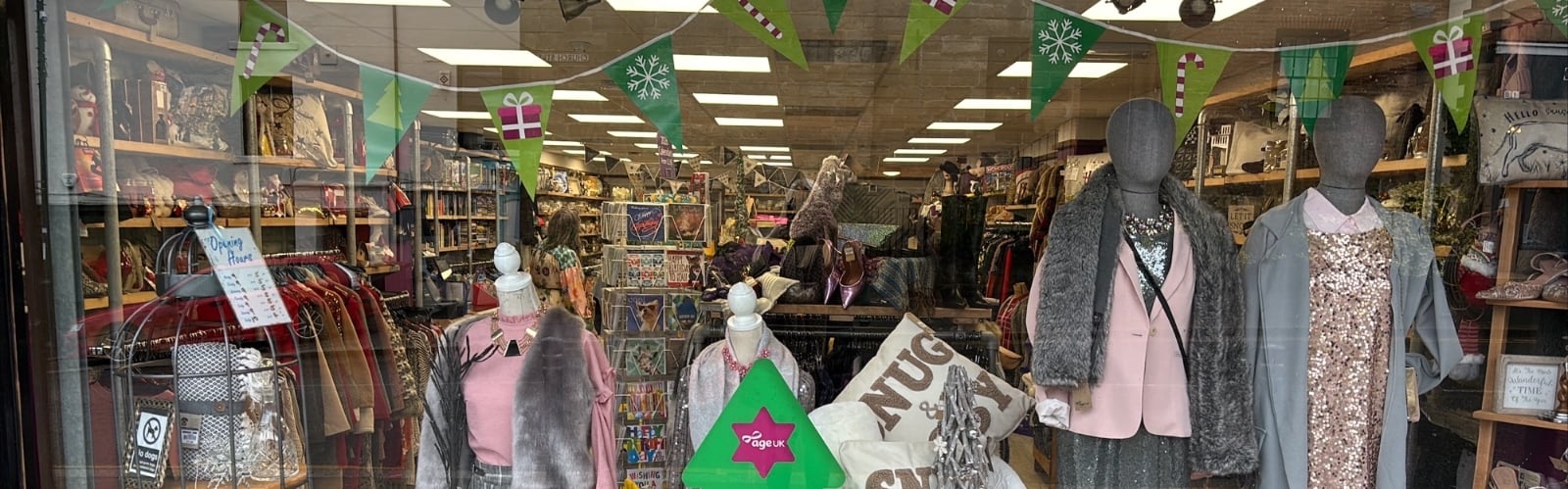 A festive window display in an Age UK charity shop