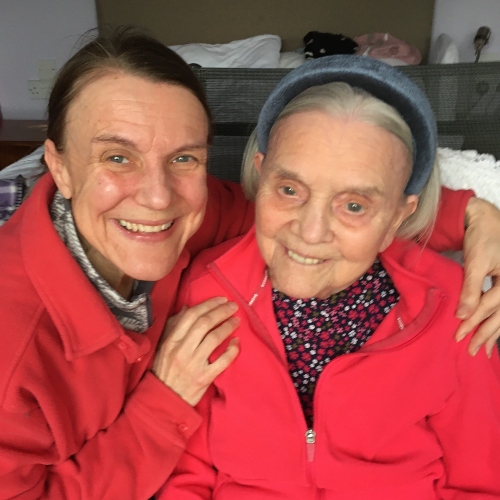 A middle aged woman with her older mother