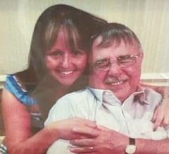 A daughter hugs her dad