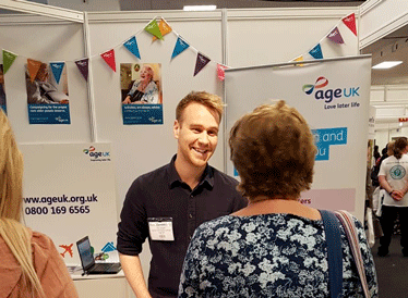 Age UK staff talking to people at the Alzheimer's Show